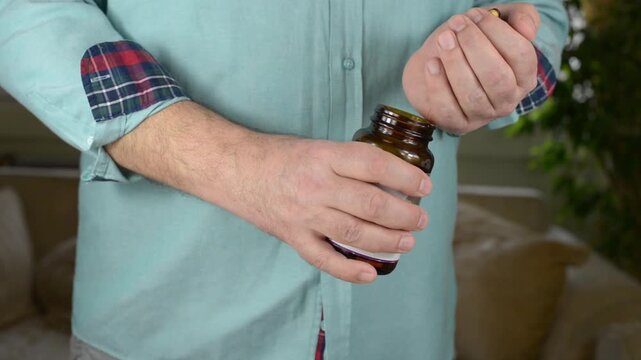 Pouring Supplement Tablets or Pills From Palm Back Into Glass Bottle with Sound