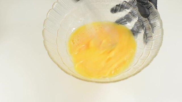 Beating Eggs in Glass Bowl with Metal Wire Whisk with sound