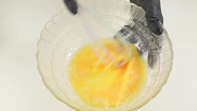 Whisking Raw Eggs in Bowl with Silicone Whisk with sound