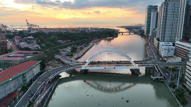 Sunset Skyline Aerial Cinematic View of Pasig River at Binondo, Manila, Philippines in 4k