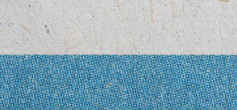 Blue CMYK Halftone Color Bar on Newsprint Macro With Paper Fibers