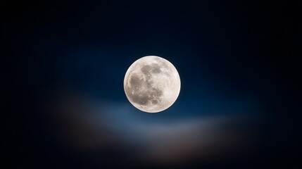 Fototapeta premium Full Moon Illuminating the Night Sky with Wispy Clouds.