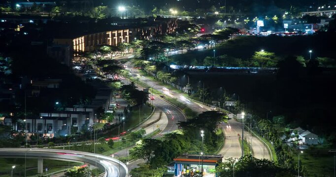 Timelapse of a busy highway intersection in Jakarta satellite city (BSD) at night