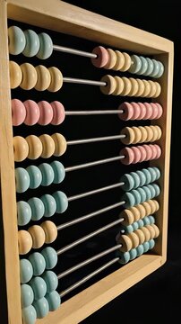 Vintage Wooden Abacus with Colorful Beads - Education, Accounting, and Historical Tools for Learning and Calculation.