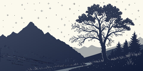 A lone tree stands tall against the backdrop of a majestic mountain range. © Mamun