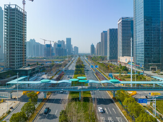 Naklejka premium Jiangcheng Avenue Aerial View with Modern Flyover and Urban Skyline