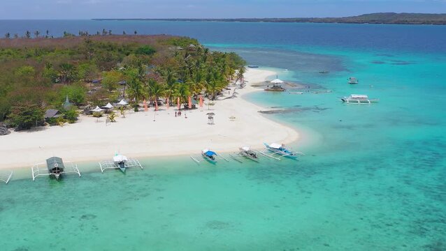 Drone view of tropical sandbar beach with turquoise lagoon