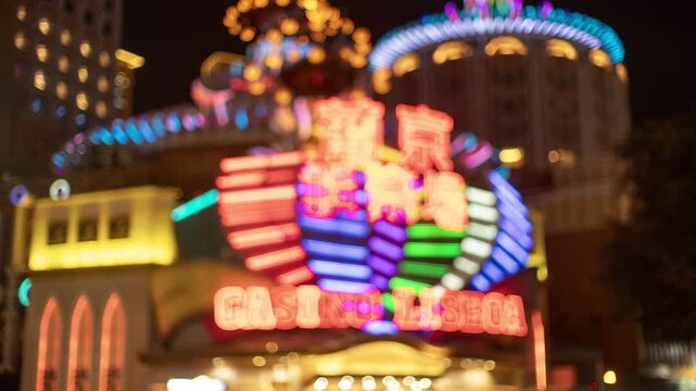 neon casino sign in the city of macau blur 