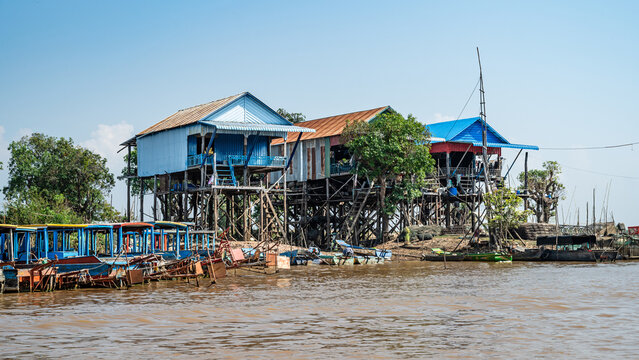 Tonle Sap Lake, Siem Reap, Cambodia &ndash; Traditional fishermen's houses built on stilts on the muddy banks of the Siem Reap River near Tonle Sap Lake.
