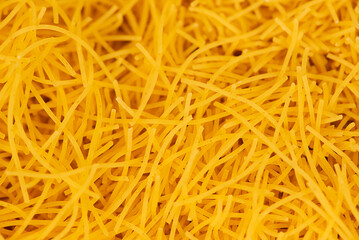 Raw vermicelli textured background, gold soup pasta pattern, small homemade noodles mock up, thin macaroni banner, Italian yellow filini pasta with copy space for text