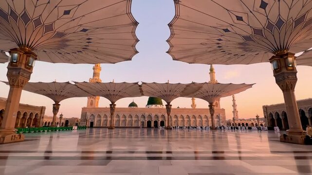 The Prophets Mosque exterior with sunshades marble plaza and detailed architecture at sunset