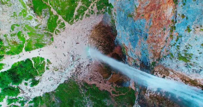 Top down shot of waterfall hitting rocks