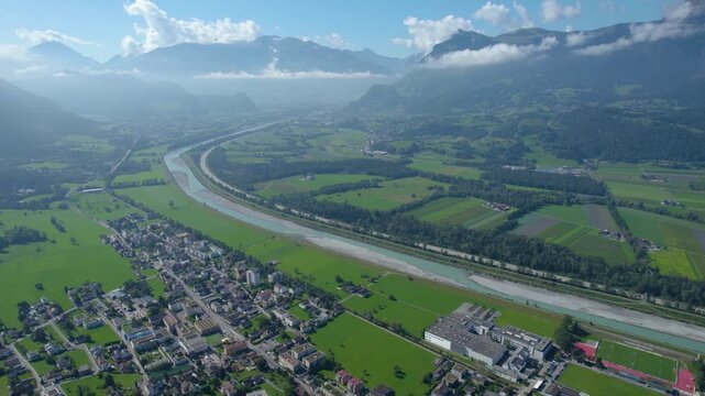 An  aerial panorama view of the old town city and mountains beside Triesenberg in Liechtenstein on a sunny noon in summer