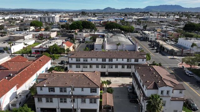 Oxnard, California, USA &ndash; High Aerial View of Urban Neighborhood and Residential Streets With City Skyline, Tree-Lined Roads, and the Topatopa Mountains in the Background on a Clear Day
