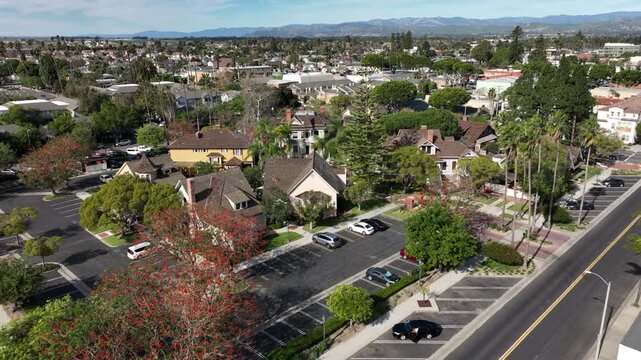 Oxnard, California, USA &ndash; Aerial View of Urban Neighborhood and Residential Streets With City Skyline, Heritage Square Historic Buildings and Park, and Topatopa Mountains in the Background