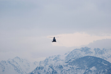 Helicopter Flying Over Snow-Capped Caucasus Mountains in Winter, Georgia