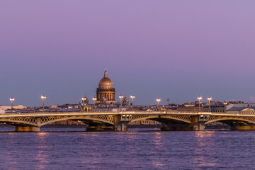 Russia, Saint Petersburg, view of the Annunciation Bridge and Saint Isaac's Cathedral at sunset