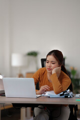 Bored unmotivated female working at home