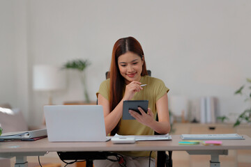 woman calculates tax invoices at home to plan her financial budget effectively