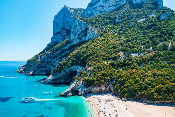 Aerial view of Cala Goloritz&egrave;, iconic turquoise bay with white limestone cliffs and crystal clear water on the Baunei Coast, Sardinia, Italy