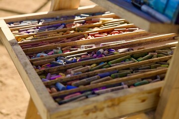 art easel with assorted pastel crayons