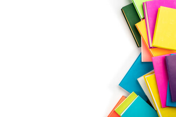 Background of books with copy space. Many colorful books. Concept of school library, children's literature, textbooks for teenagers.