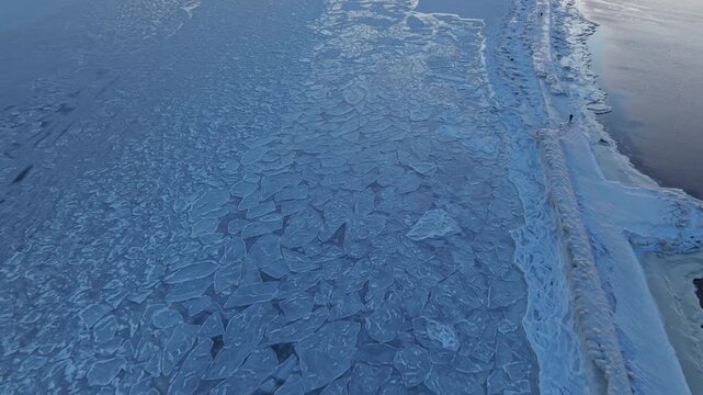 Ice coastline panorama. Tranquil winter landscape showing layered ice formations and gentle sea boundary
