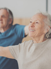 An elderly couple exercising