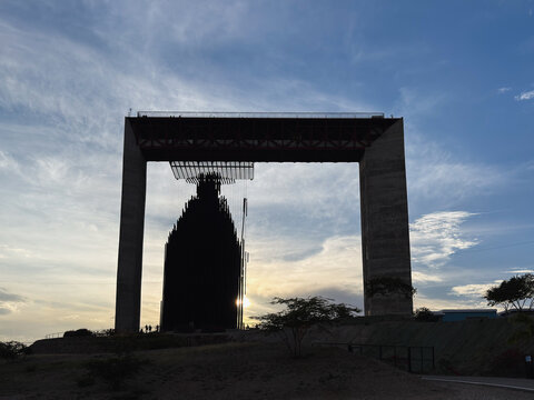 Silhouette of religious architecture under a majestic twilight sky, modern monument Divina Pastora, Barquisimeto, Lara, Venezuela