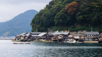 Ine Fishing Village, Kyoto prefecture, Japan, Ine-ura landscape coastal view, Funaya, traditional wooden boat houses, Ine Bay during boat tour cruise, Yoza District, in a autumn fall day