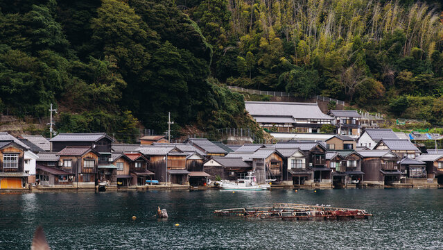 Ine Fishing Village, Kyoto prefecture, Japan, Ine-ura landscape coastal view, Funaya, traditional wooden boat houses, Ine Bay during boat tour cruise, Yoza District, in a autumn fall day