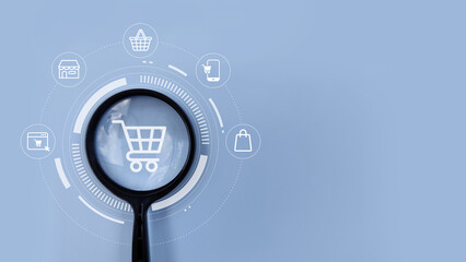 Fototapeta premium Magnifying glass on shopping cart icon representing e-commerce, online shopping, digital retail, and modern marketplace.