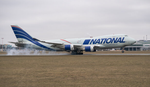 PRAGUE, CZECH REPUBLIC &ndash; February 10, 2026: National Airlines Boeing 747 cargo plane touching down on runway with tire smoke.
