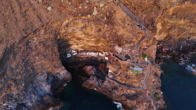 Aerial drone footage of Por&iacute;s de Candelaria cave houses after sunset, La Palma, Canary Islands