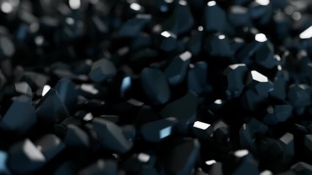 Dark shiny crystalline shapes moving in macro.