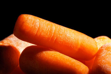 baby carrots macro on black background