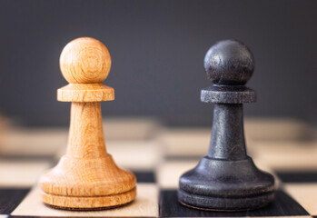 chess pieces on a chessboard on a dark background