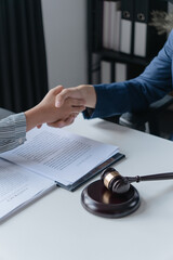 Attorney consulting clients in law firm office with professional discussion