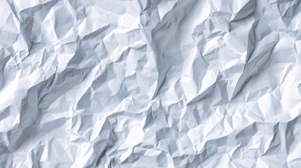 Obraz premium Close-up of crumpled white paper texture with soft lighting and shadows