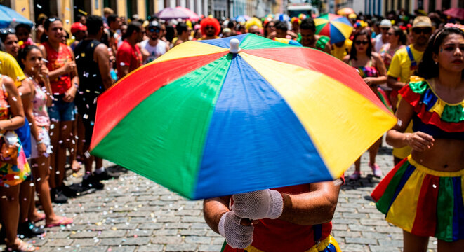 Person Holding Colorful Rainbow Umbrella in Crowded Brazilian Carnival Street Party
