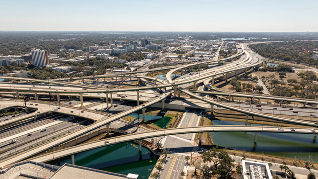 A sweeping drone view reveals the scale of Orlando&rsquo;s transportation network cutting through the heart of the city.