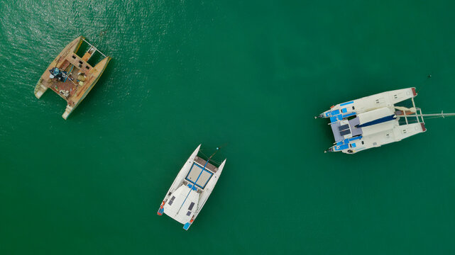 Aerial View of Catamarans Anchored in Turquoise Sea