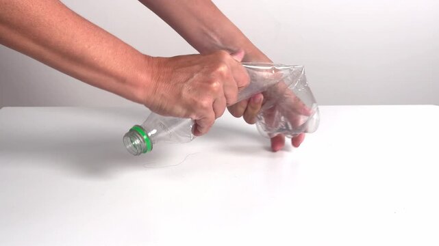 Video with real sound effect of Plastic PET bottle crinkling squeezing