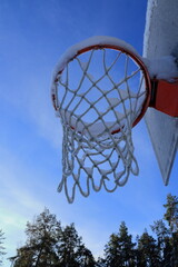 Play basketball in the snow. Nordic winter sport during January. 