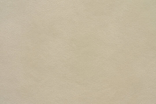 Beige suede leather texture background, natural soft fabric surface