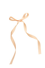 Beige ribbon bow isolated on white background, elegant gift wrapping decoration