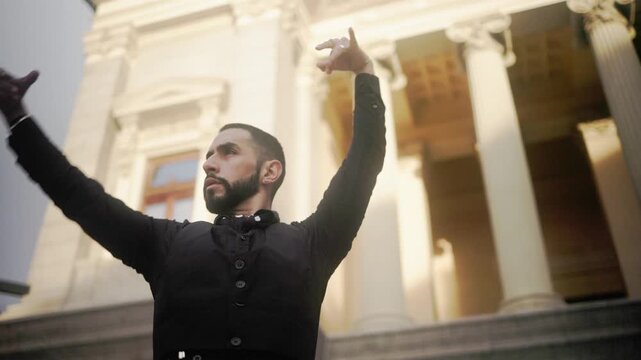 Male flamenco dancer performing traditional spanish dance outdoors