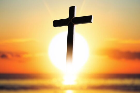 The christian Cross symbol of easter in bright sky