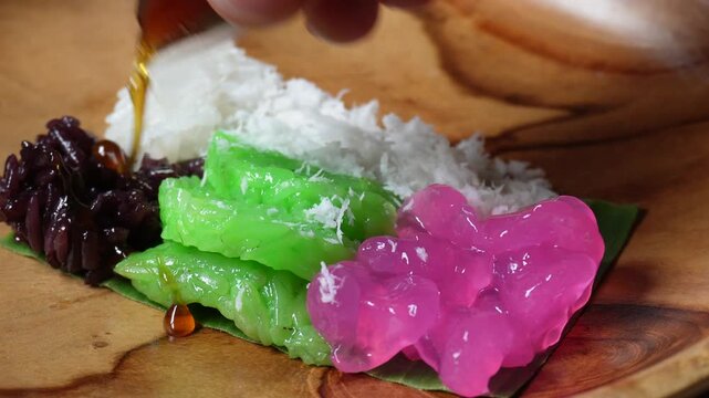 Glazing traditional food from indonesia with palm sugar in liquid form