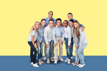 Obraz premium Happy young men and women standing against white background